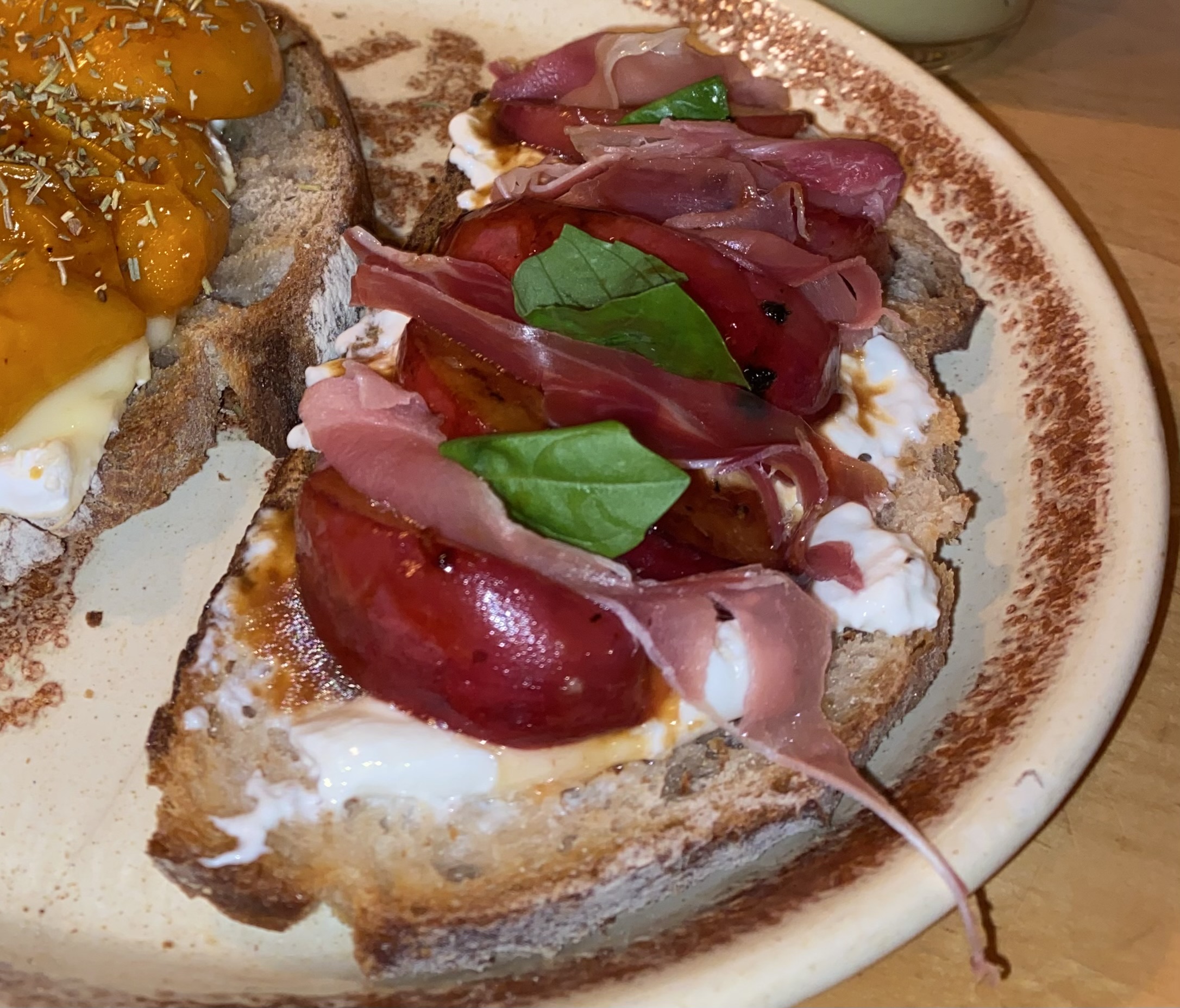 Burrata peach and basil toast
